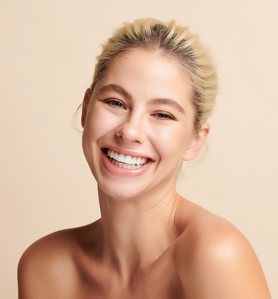 Beautiful smile young woman. White teeth on white background,