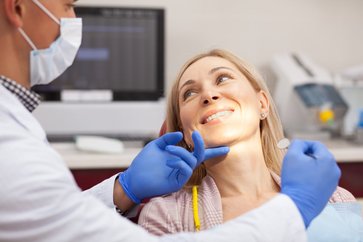 Patient smiling during a dental exam at North Creek Dental Care