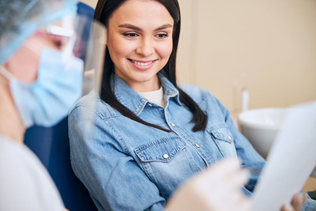 Portrait of happy woman that listening to dentist