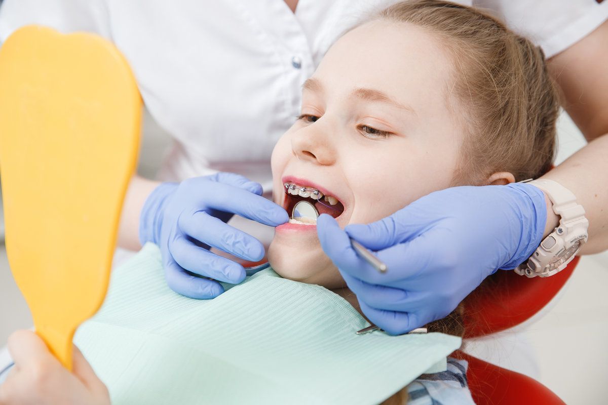 Child smiling after dental sealants at North Creek Dental Care in Tinley Park