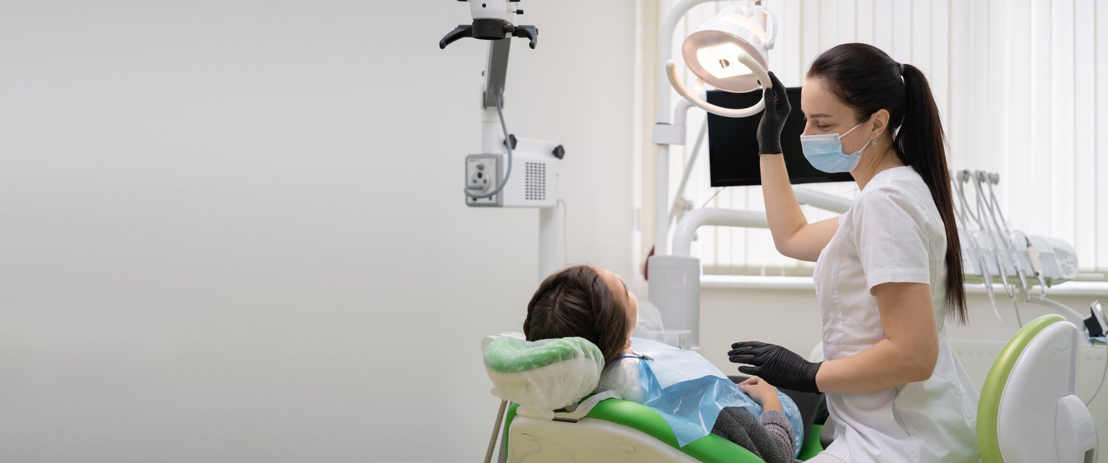 Dentist reviewing a patient's gum health during a dental exam