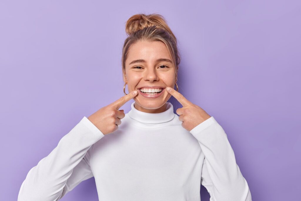 Dental care concept showing porcelain veneers and teeth whitening comparison