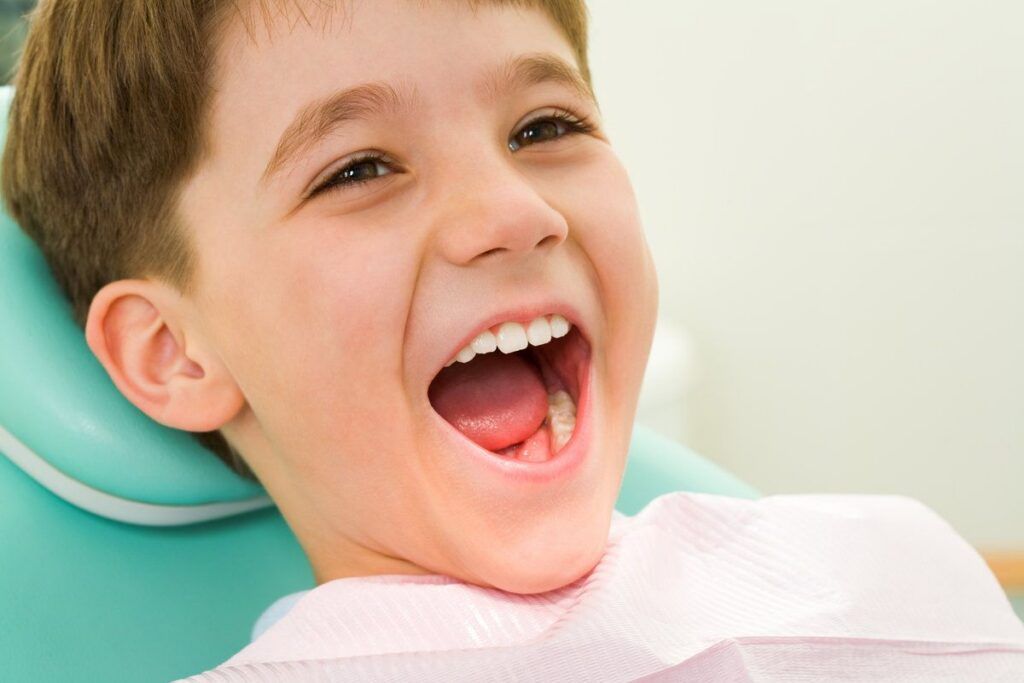 Happy kid at dental clinic
