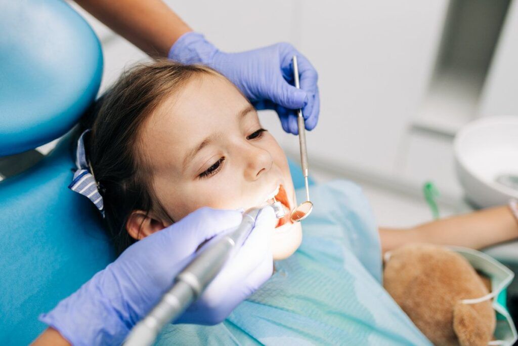 Happy kid at dental clinic