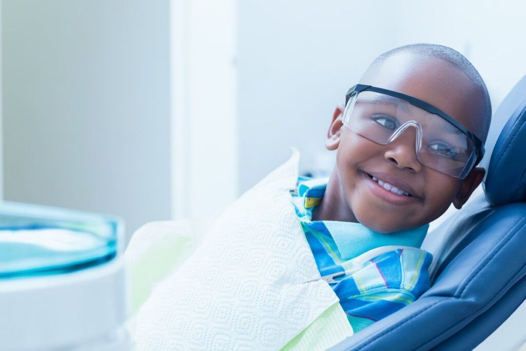 Happy kid at dental clinic
