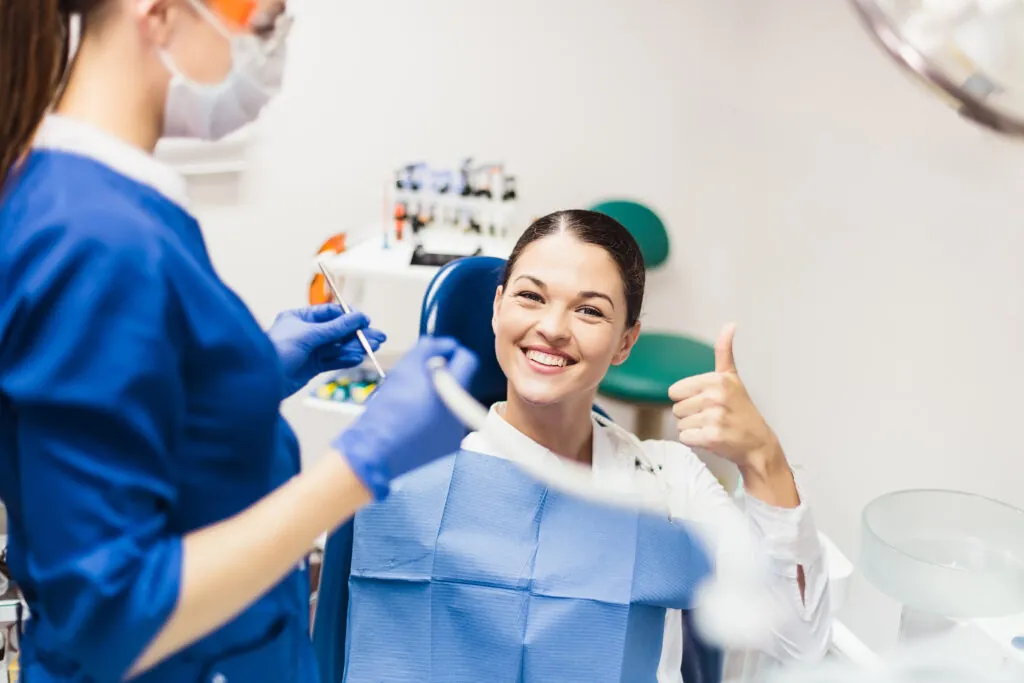 Girl patient smiling in dentist's chair