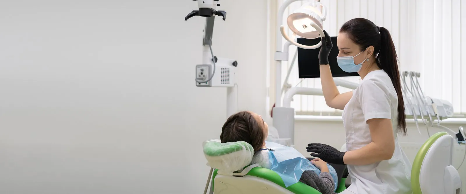 Dentist reviewing a patient's gum health during a dental exam